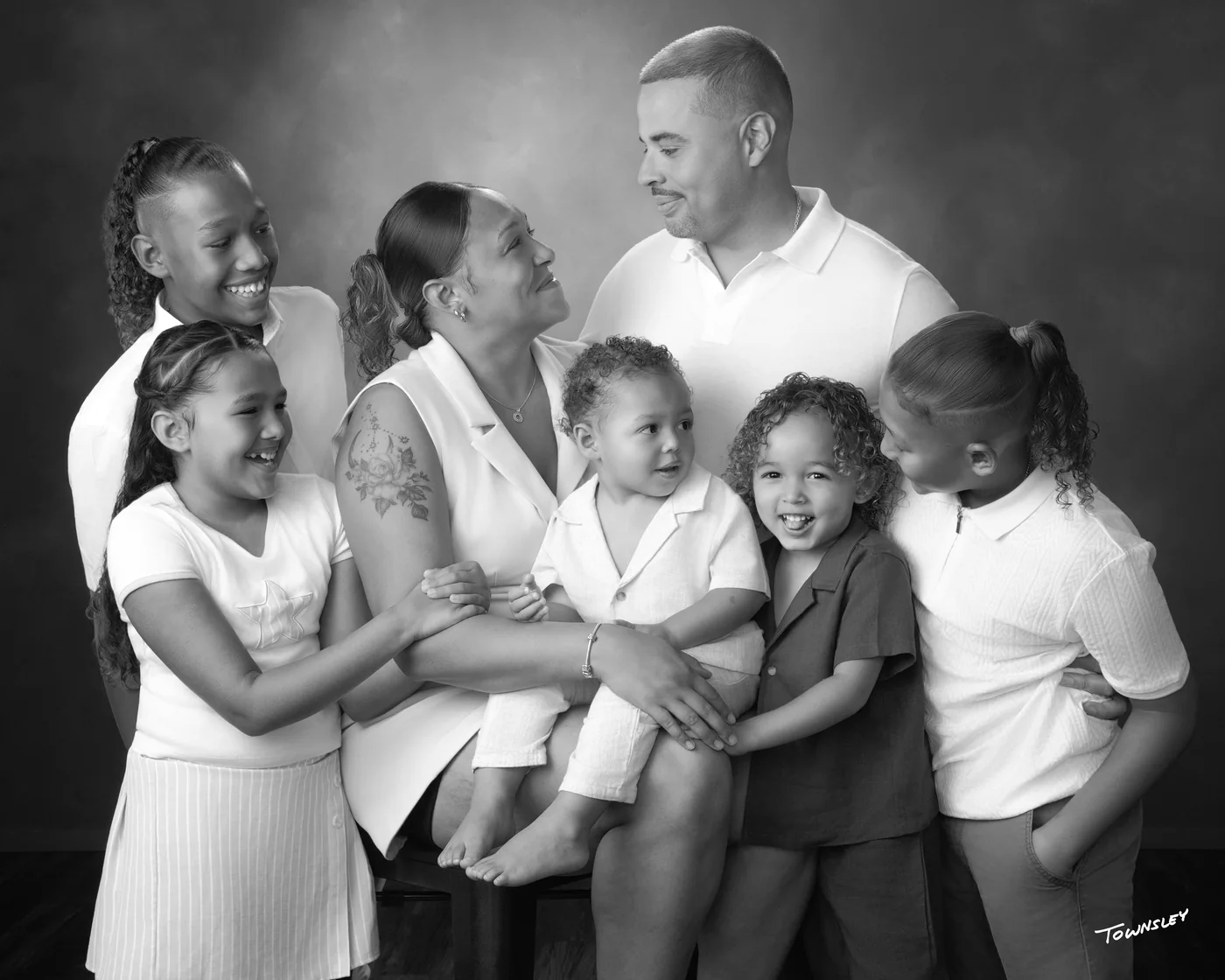 Nicholas with his family, a black-and-white studio portrait.