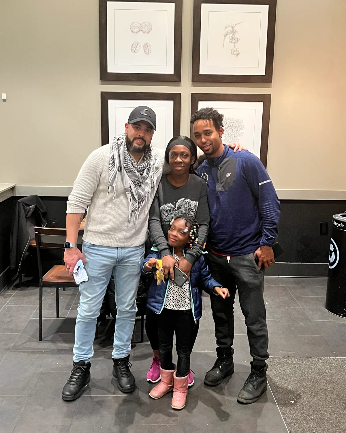 Nicholas with a family holding the keys to their new home.