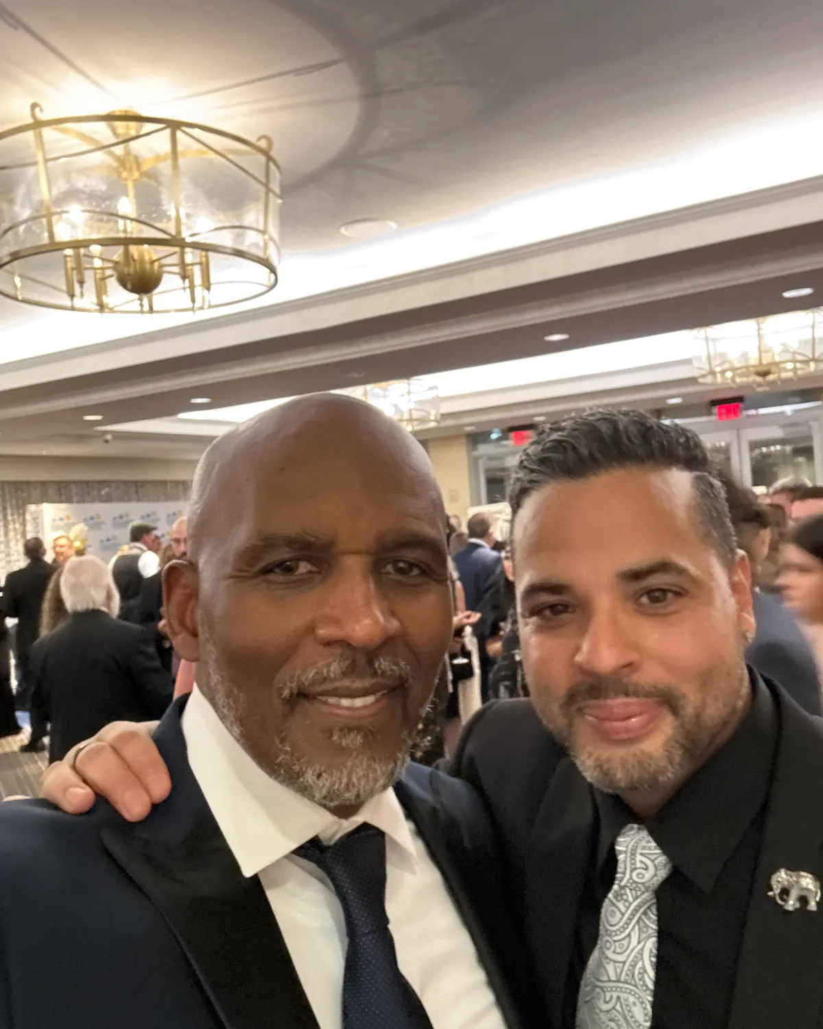 Nicholas with Scott Lewis, broker of Lewis Real Estate, at a fundraiser the firm supported.